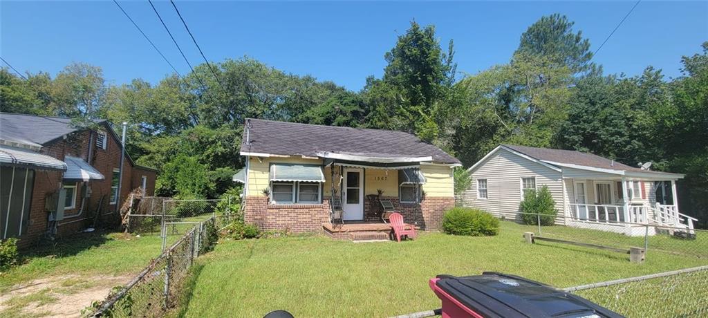 back of house with a yard