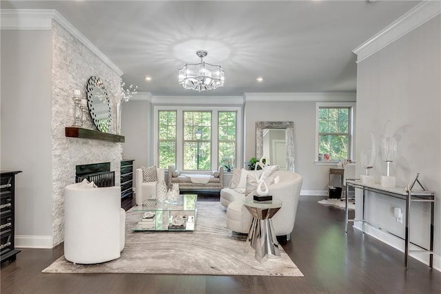 living room with dark hardwood / wood-style flooring, crown molding, and a wealth of natural light