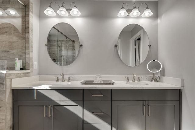 bathroom featuring vanity and a shower with shower door