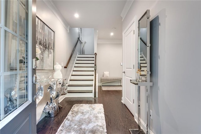 interior space with hardwood / wood-style flooring and crown molding