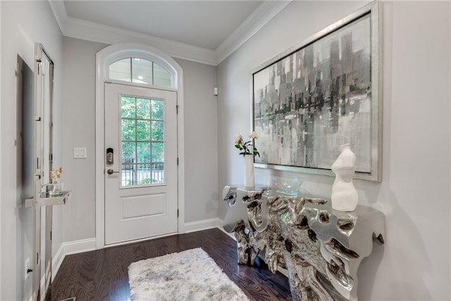 entrance foyer with crown molding and dark hardwood / wood-style flooring