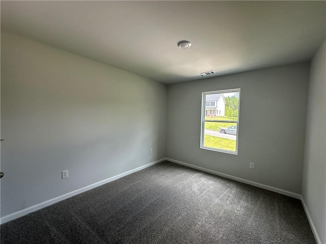 15 Fontana Ct, Covington, GA 30016 - spare room featuring baseboards and dark carpet