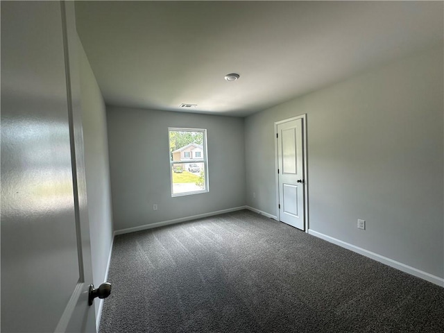 15 Fontana Ct, Covington, GA 30016 - unfurnished room featuring dark colored carpet and baseboards