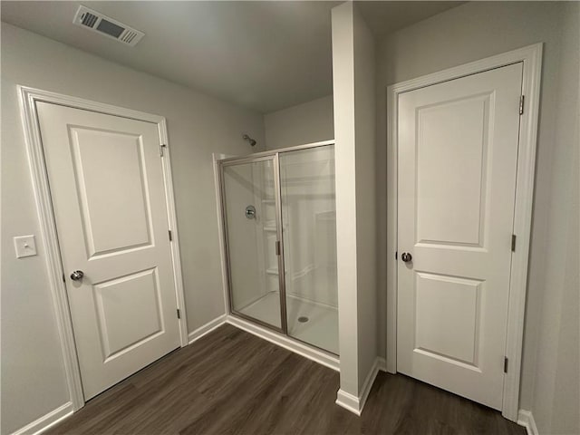 15 Fontana Ct, Covington, GA 30016 - bathroom featuring wood finished floors and a shower stall