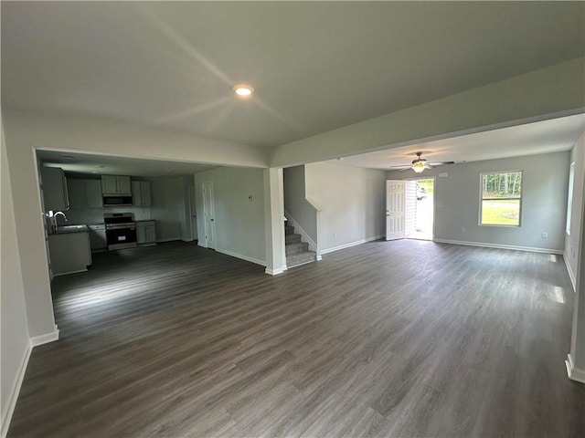 15 Fontana Ct, Covington, GA 30016 - unfurnished living room featuring stairway, dark wood-type flooring, a ceiling fan, and recessed lighting
