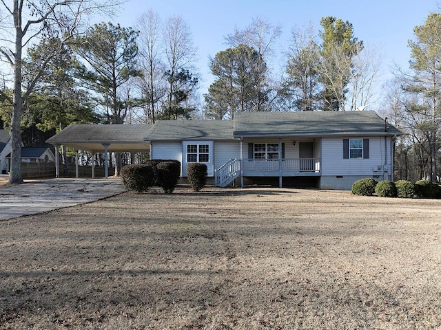 single story home featuring a front yard and a carport