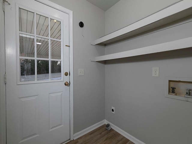 laundry room featuring hookup for a washing machine, electric dryer hookup, and dark wood-type flooring