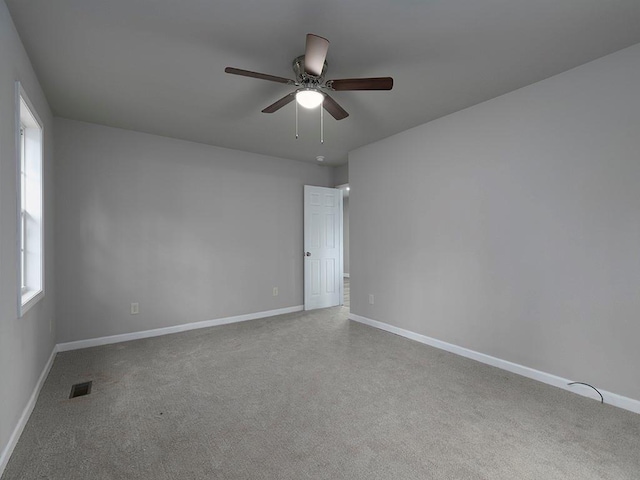 unfurnished room with ceiling fan and carpet floors