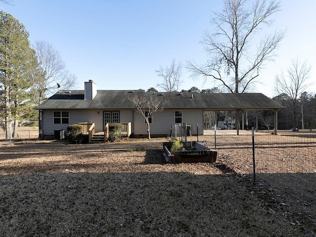 rear view of property with a deck