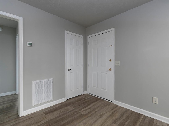 unfurnished bedroom featuring wood-type flooring