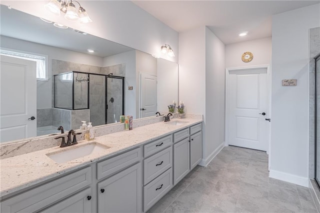 bathroom featuring walk in shower and vanity