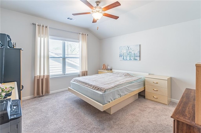 bedroom with ceiling fan, light colored carpet, and lofted ceiling