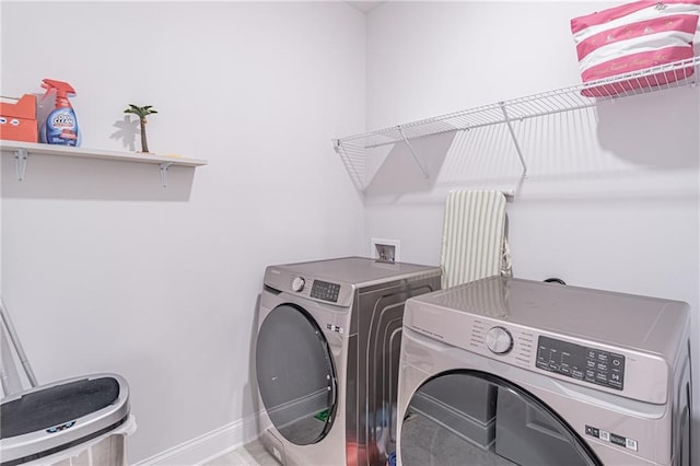 laundry area with independent washer and dryer