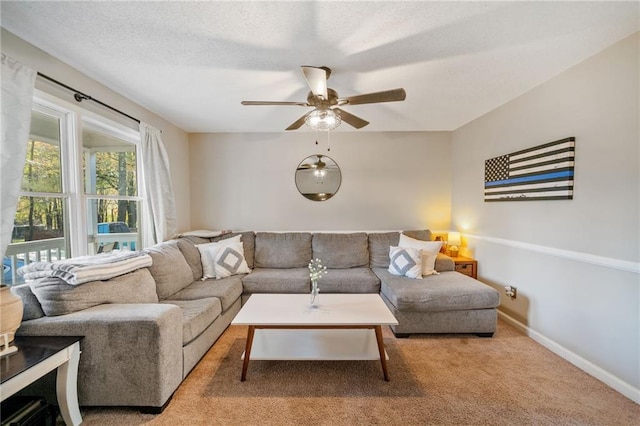 carpeted living room featuring ceiling fan