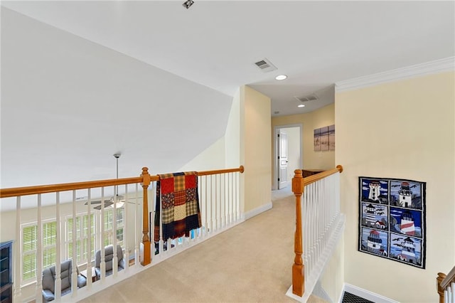 hall with an upstairs landing, carpet floors, baseboards, recessed lighting, and ornamental molding