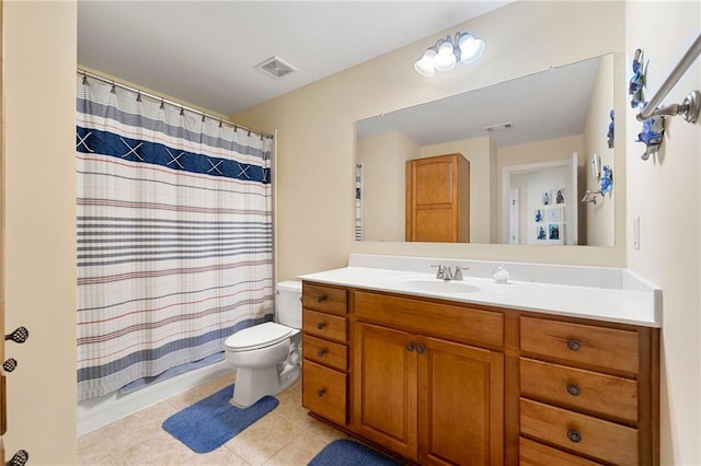 bathroom featuring toilet, tile patterned flooring, vanity, and shower / bath combo