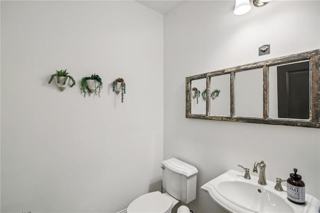 bathroom with sink and toilet