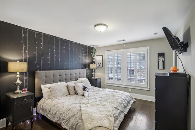 bedroom featuring dark hardwood / wood-style floors