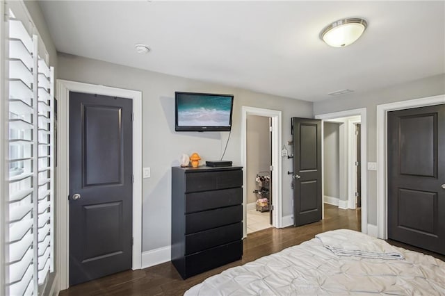 bedroom featuring dark wood-type flooring