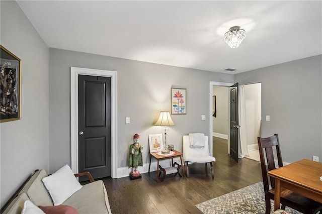 living room featuring dark wood-type flooring