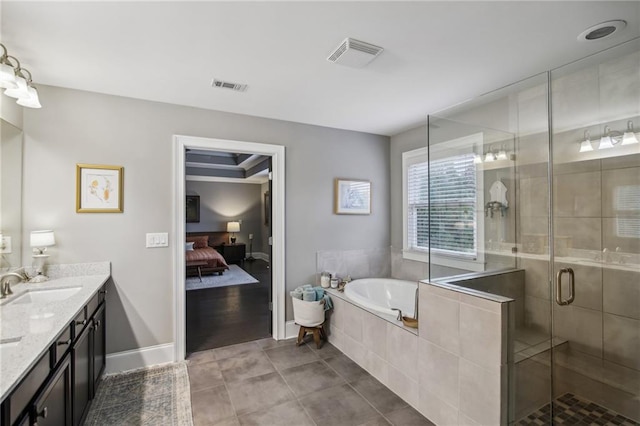 bathroom with vanity, shower with separate bathtub, and tile patterned flooring