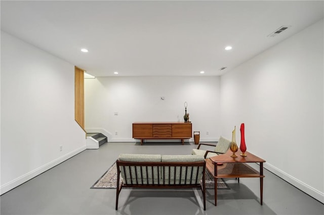 living area featuring concrete flooring