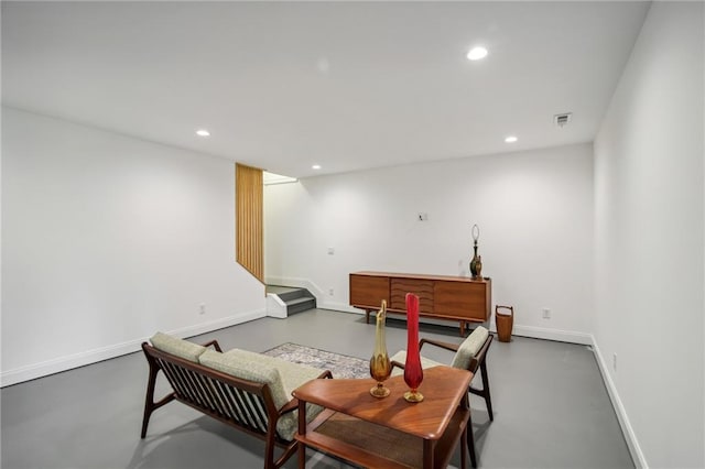 interior space with concrete flooring and ornate columns