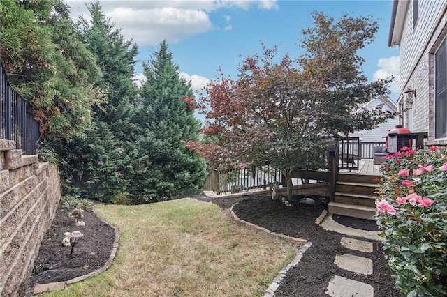 view of yard with a wooden deck