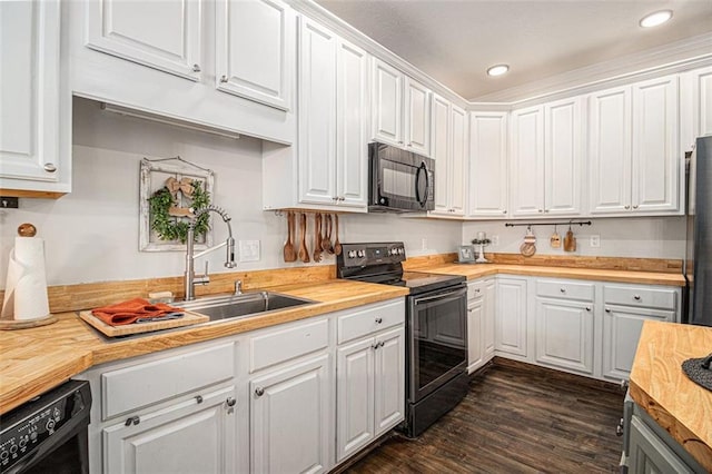 232 Christian Cir, Carrollton, GA 30116 - kitchen with black appliances, butcher block countertops, white cabinets, dark wood-style floors, and a sink