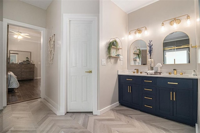 232 Christian Cir, Carrollton, GA 30116 - full bath with double vanity, baseboards, and a ceiling fan