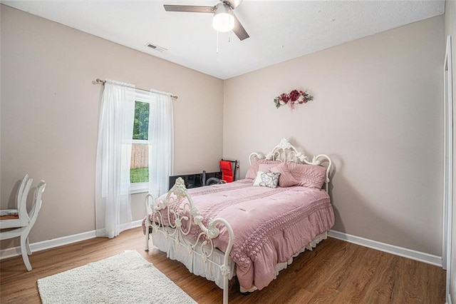 232 Christian Cir, Carrollton, GA 30116 - bedroom with wood finished floors, baseboards, and a ceiling fan