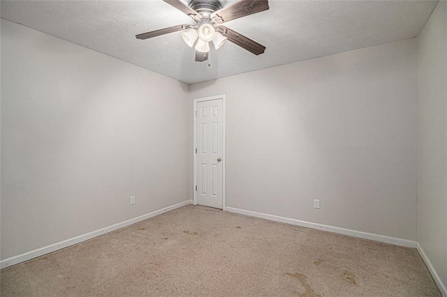 232 Christian Cir, Carrollton, GA 30116 - empty room with light colored carpet, baseboards, a ceiling fan, and a textured ceiling