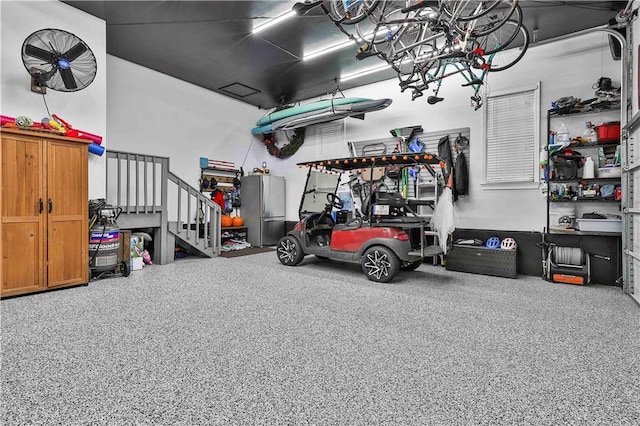 garage featuring stainless steel refrigerator