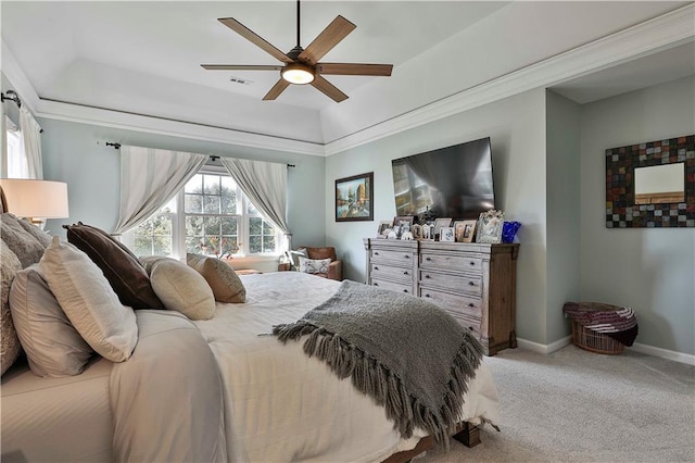 bedroom featuring ceiling fan, carpet flooring, and a raised ceiling