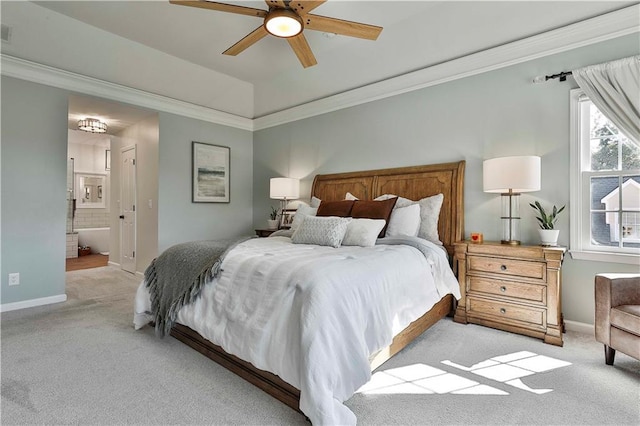 carpeted bedroom with ceiling fan, crown molding, and connected bathroom