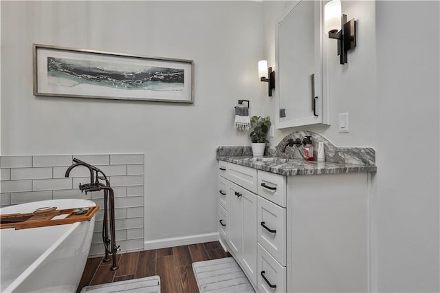 bathroom with a bathtub and vanity