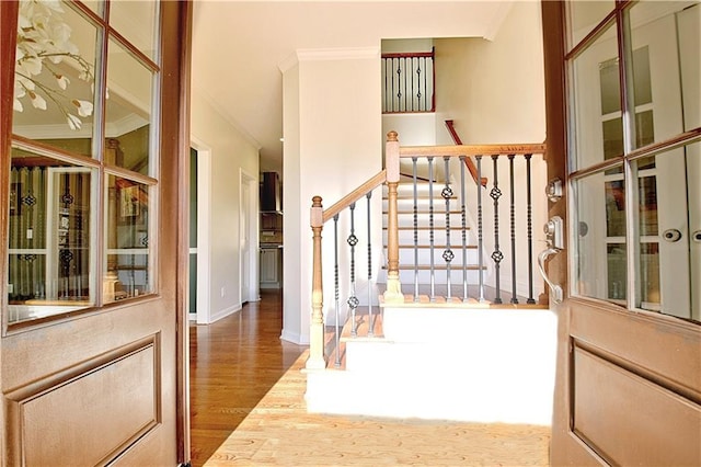 interior space featuring crown molding and wood-type flooring