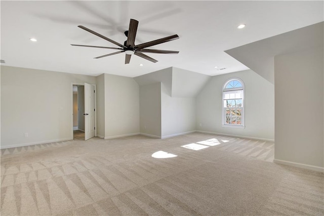 bonus room featuring ceiling fan, light colored carpet, and lofted ceiling