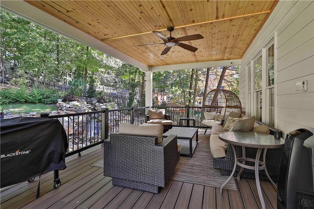 deck featuring ceiling fan, an outdoor hangout area, and area for grilling