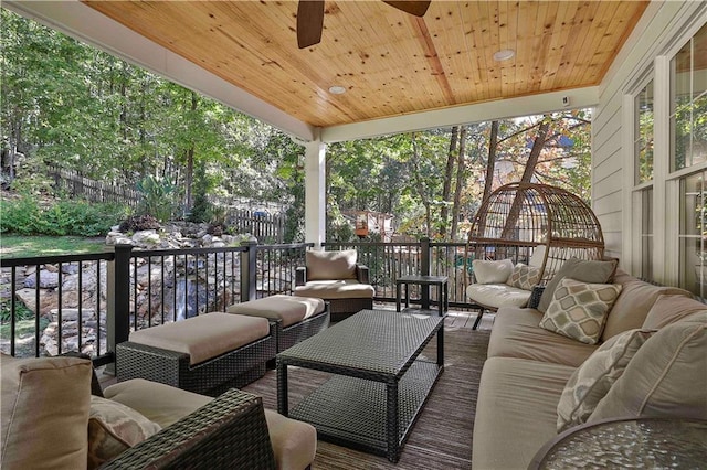 exterior space with an outdoor living space and ceiling fan