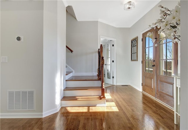 foyer featuring french doors and hardwood / wood-style flooring