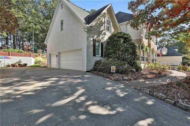 view of side of property with a garage