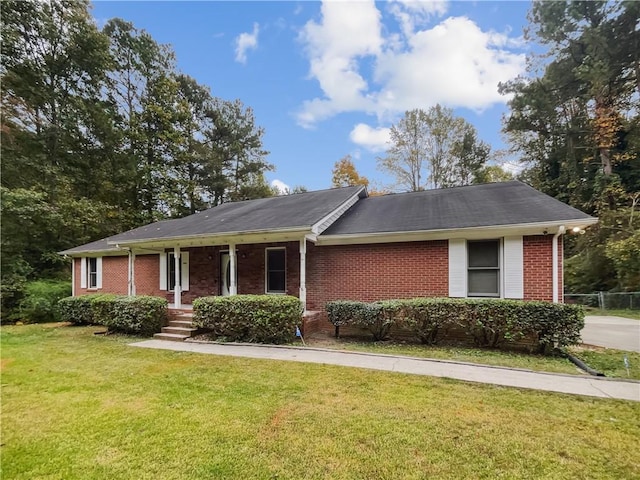 ranch-style house with a porch and a front yard