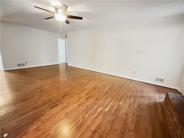 unfurnished room featuring hardwood / wood-style flooring and ceiling fan