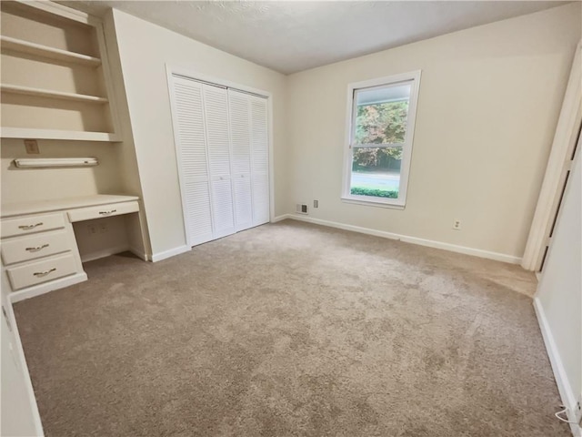 unfurnished bedroom with light carpet