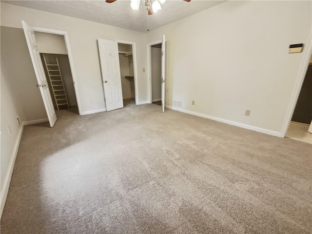 unfurnished bedroom featuring light carpet and ceiling fan