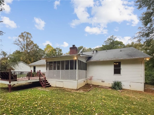 back of property with a sunroom, a yard, and a deck