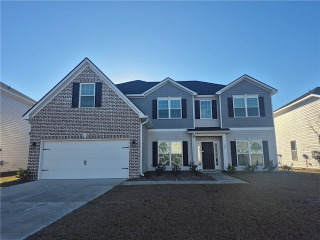 view of front of house featuring a garage, a front lawn, concrete driveway, and brick siding