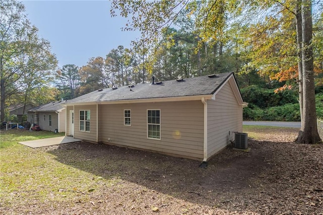 back of house featuring central AC and a patio area