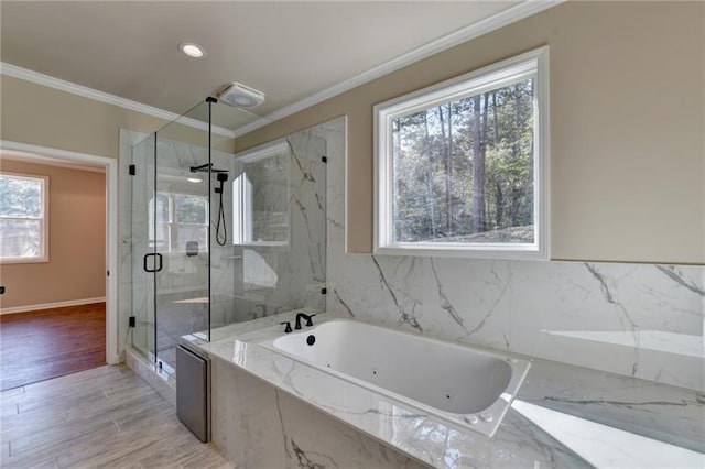 bathroom featuring wood finished floors, crown molding, a marble finish shower, and a bath